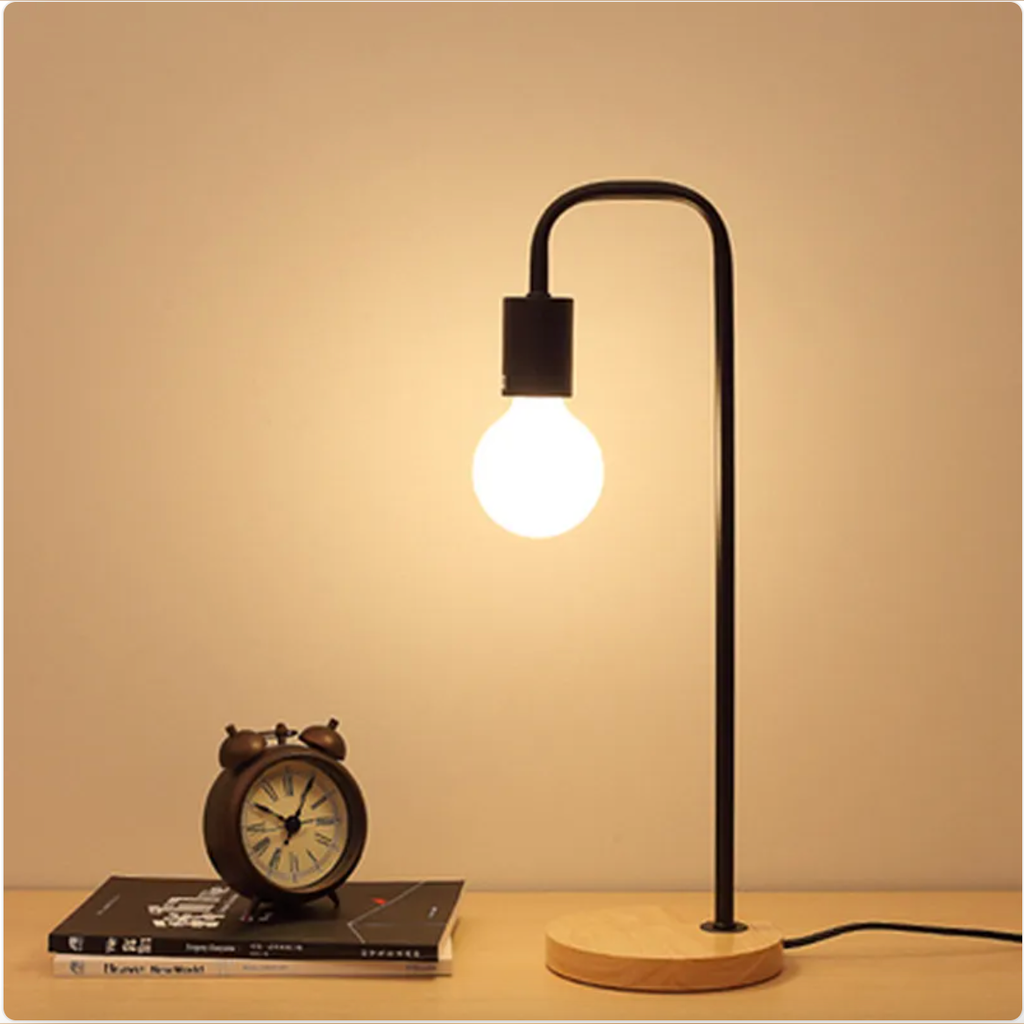 Black curved-arm table lamp with wood base