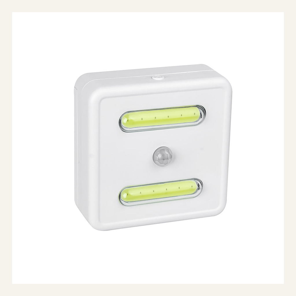 White motion-sensor cabinet light full product view