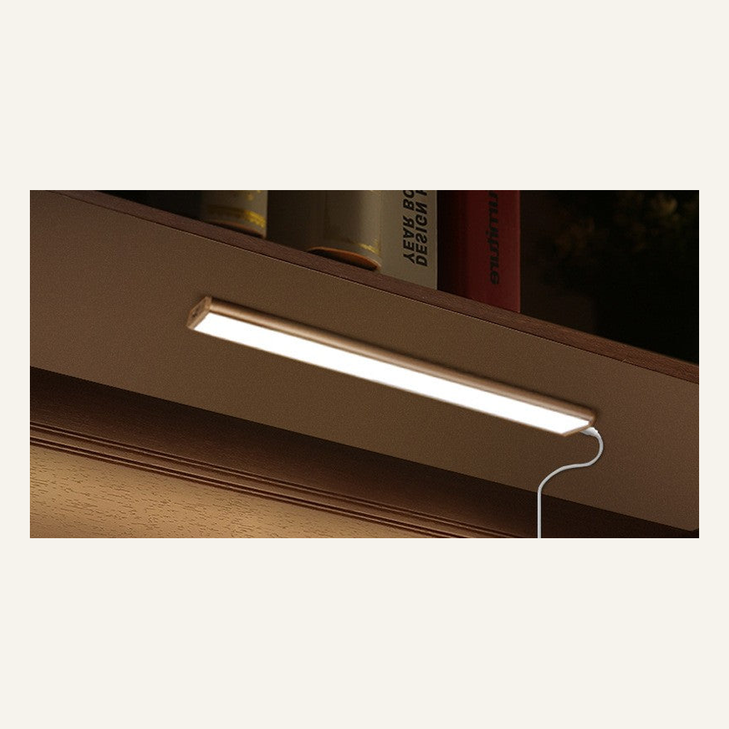 Slim cabinet light bar installed under a shelf
