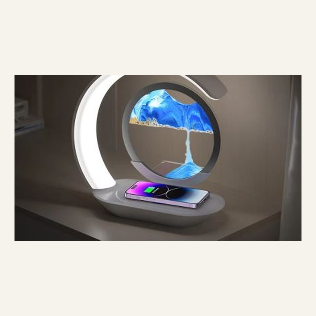 Blue quicksand desk lamp with phone on charging base