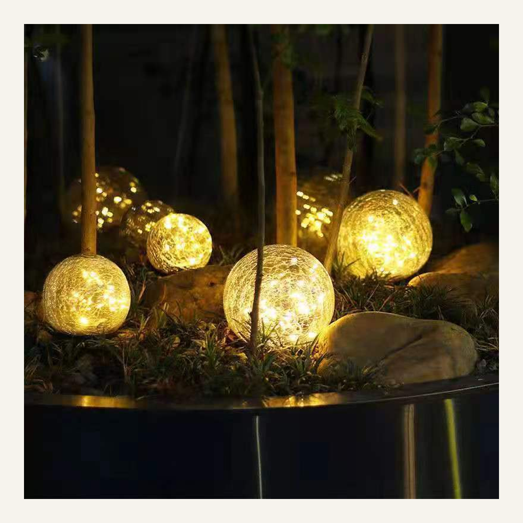 Cracked-glass solar ground lights in a garden setting
