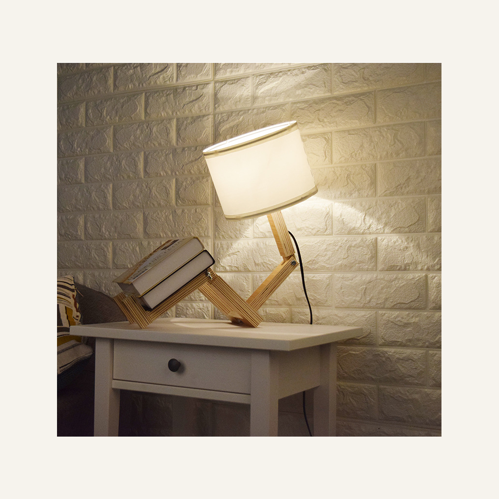 Wooden adjustable bedside lamp in a bedroom setting