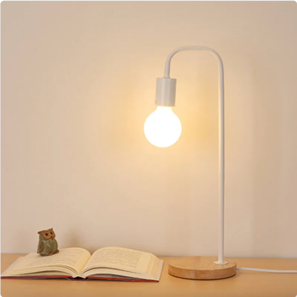 White curved-arm table lamp with wood base