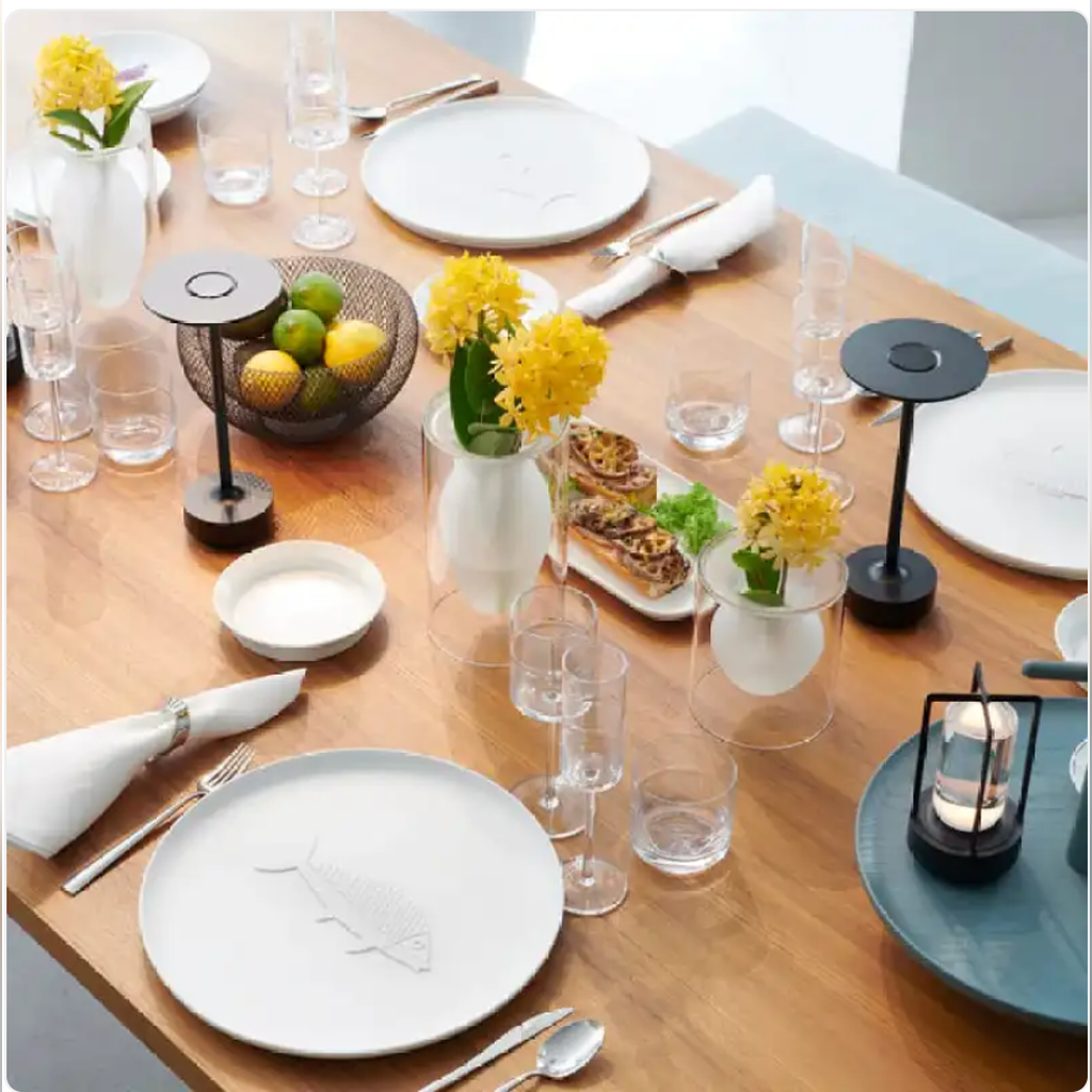 Rechargeable metal table lamps in a dining setting