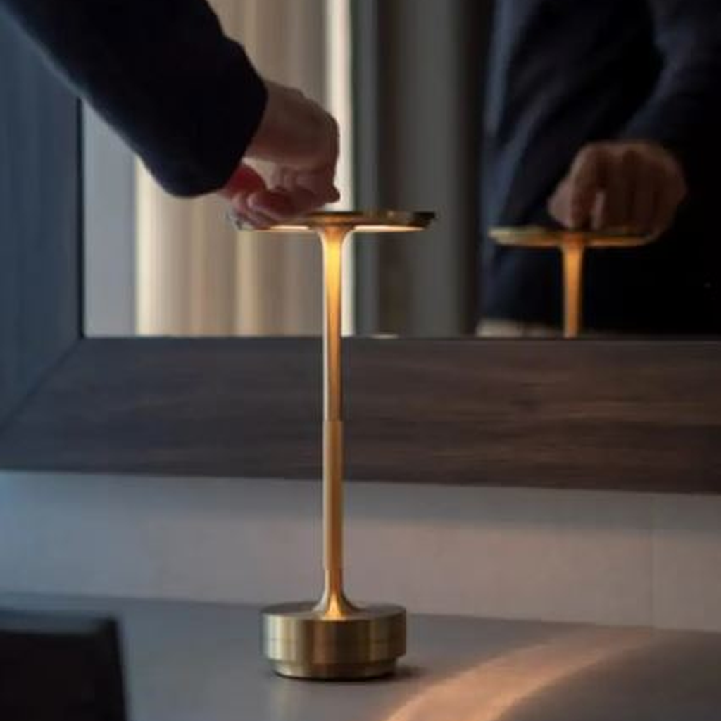 Gold metal desk lamp touch control in use