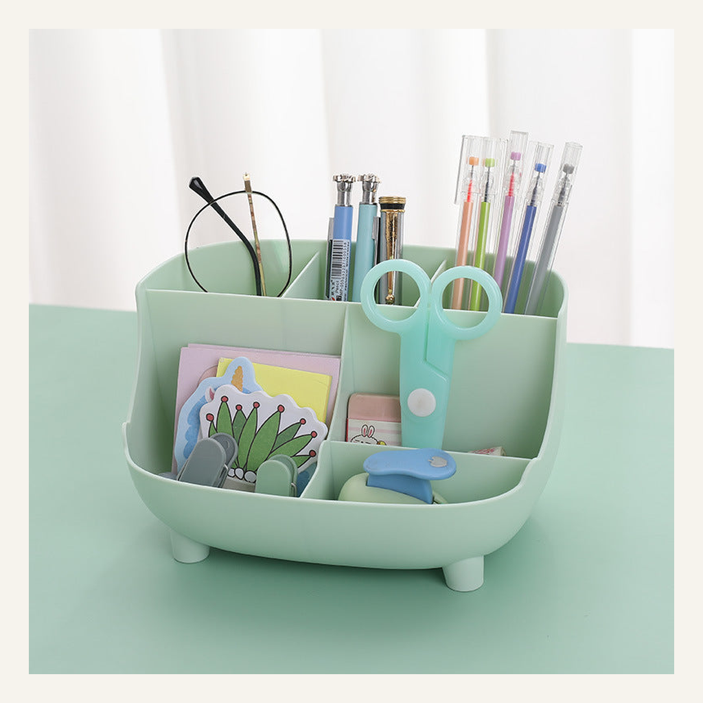 Green six-compartment desktop organizer with stationery