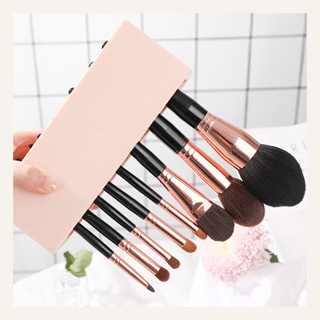 Pink makeup brush organizer shown in hand