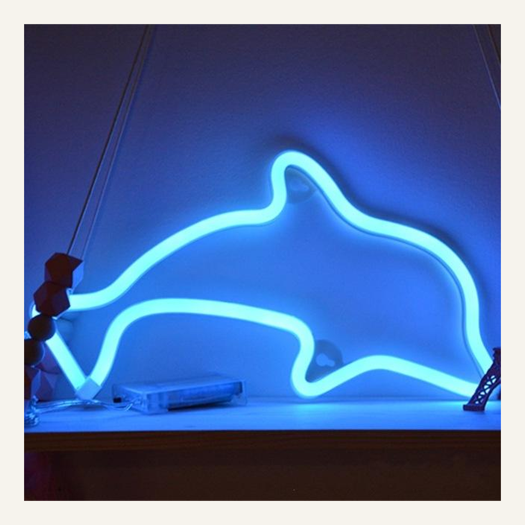 Blue dolphin LED accent lamp on a shelf