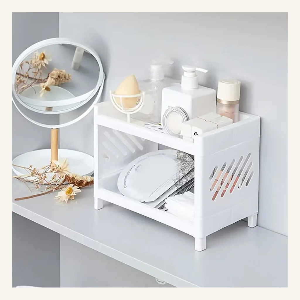 White two-tier shelf organizing vanity items