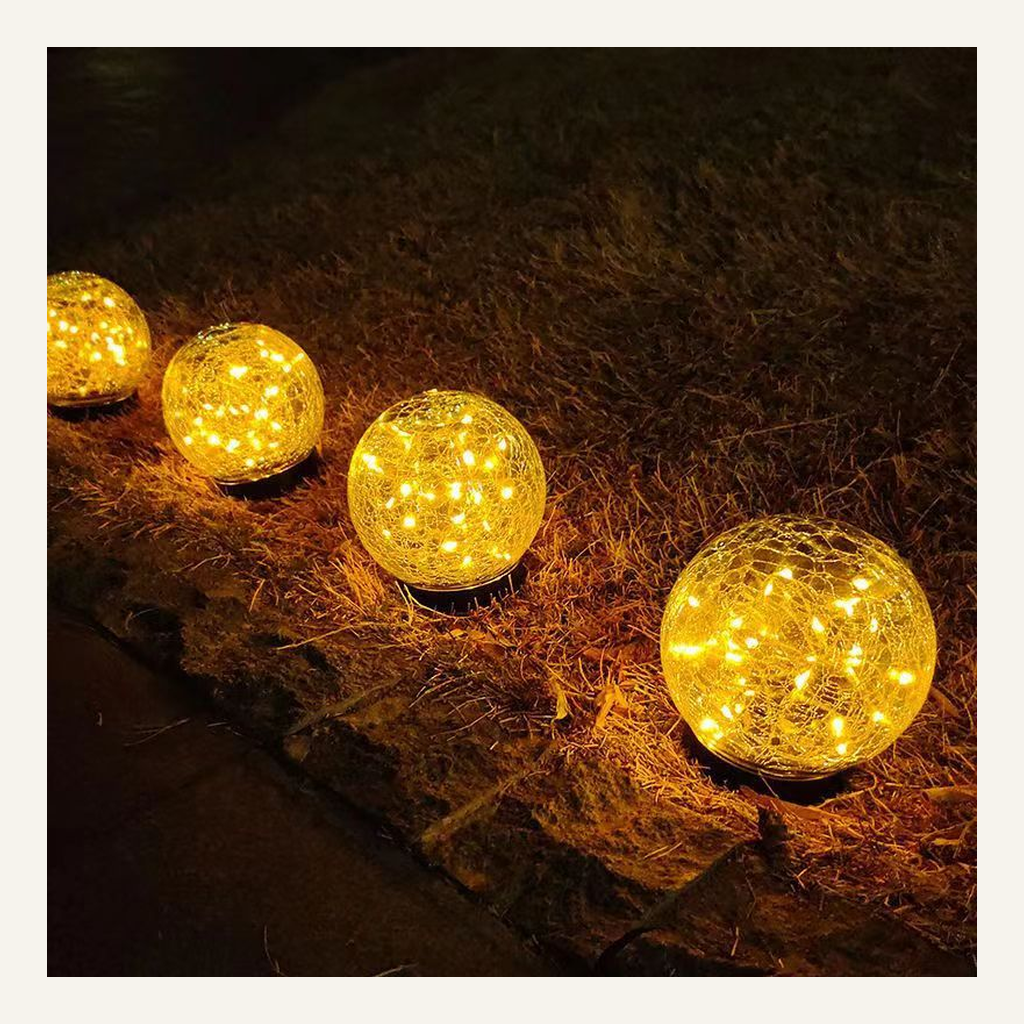 Cracked-glass solar ground lights illuminated outdoors