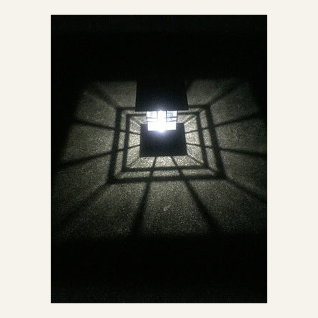 Black solar pillar light geometric ground pattern detail