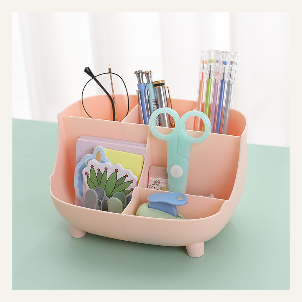 Pink six-compartment desktop organizer with stationery