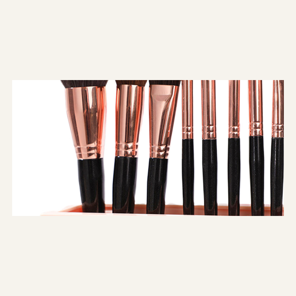 Pink makeup brush organizer slot and brush detail
