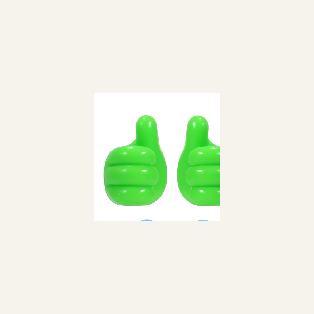 Green thumb-shaped wall hook pair detail