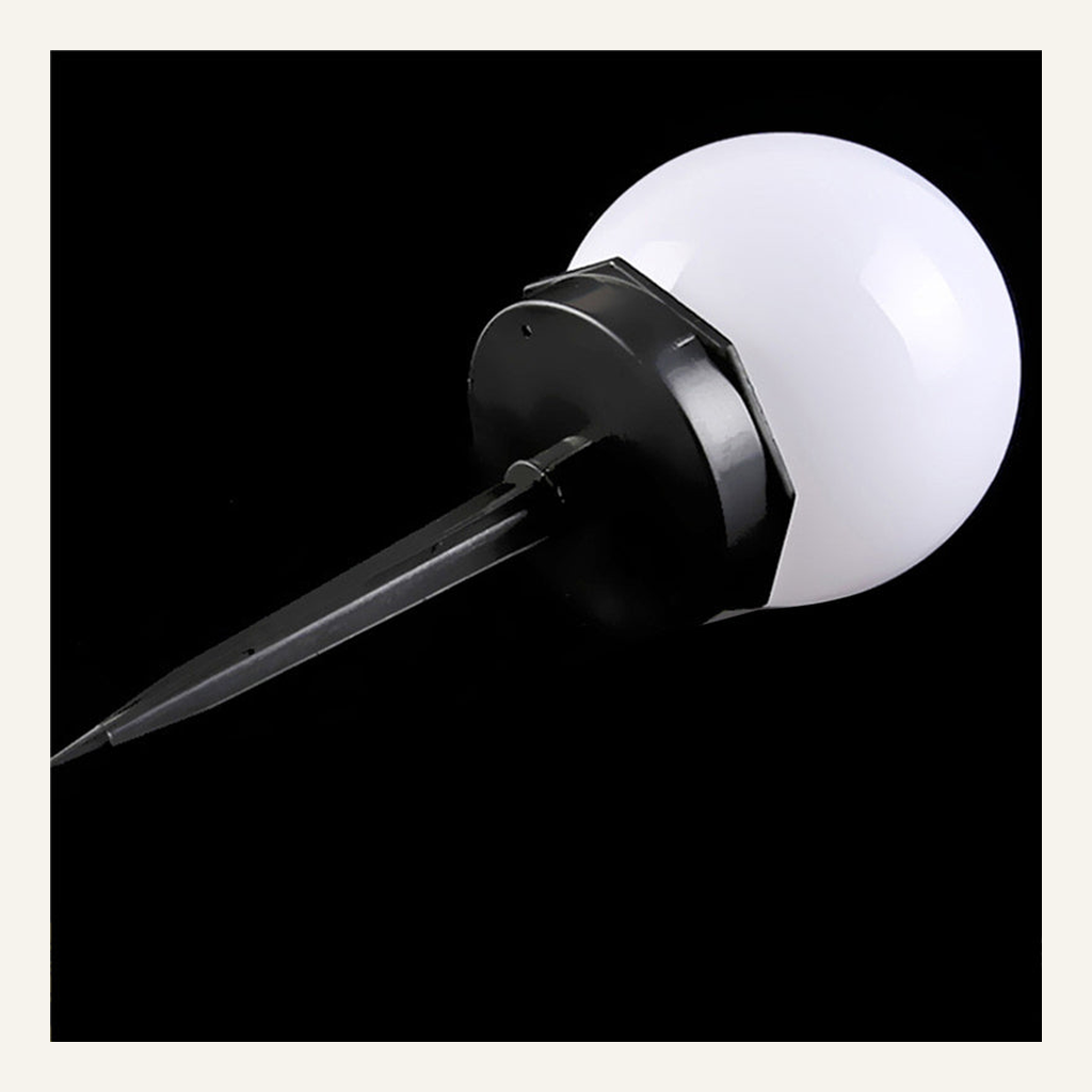 White solar globe garden light angled product view