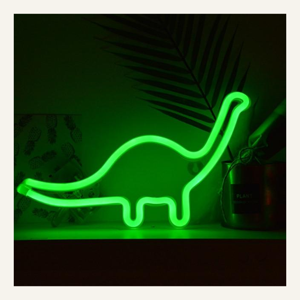 Green dinosaur LED accent lamp in a low-light setting