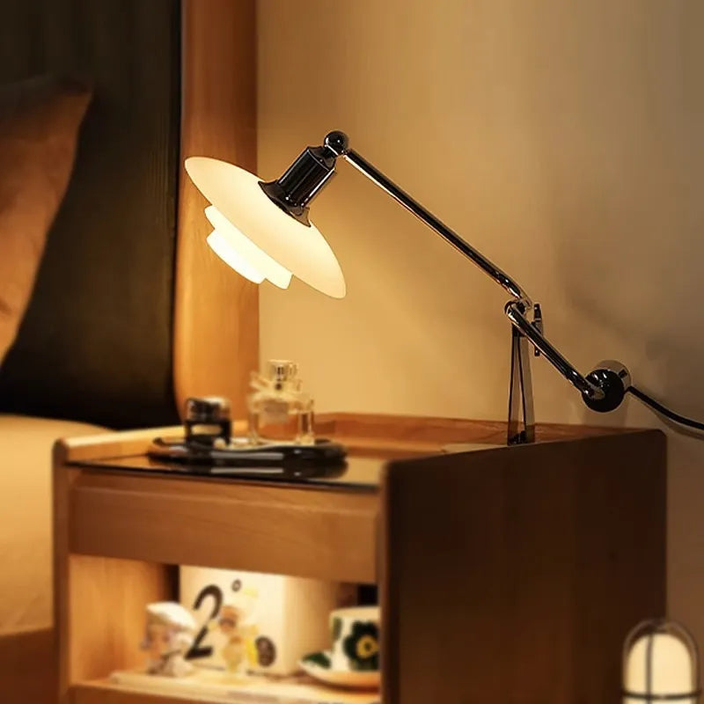 Chrome glass desk lamp in a bedside setting