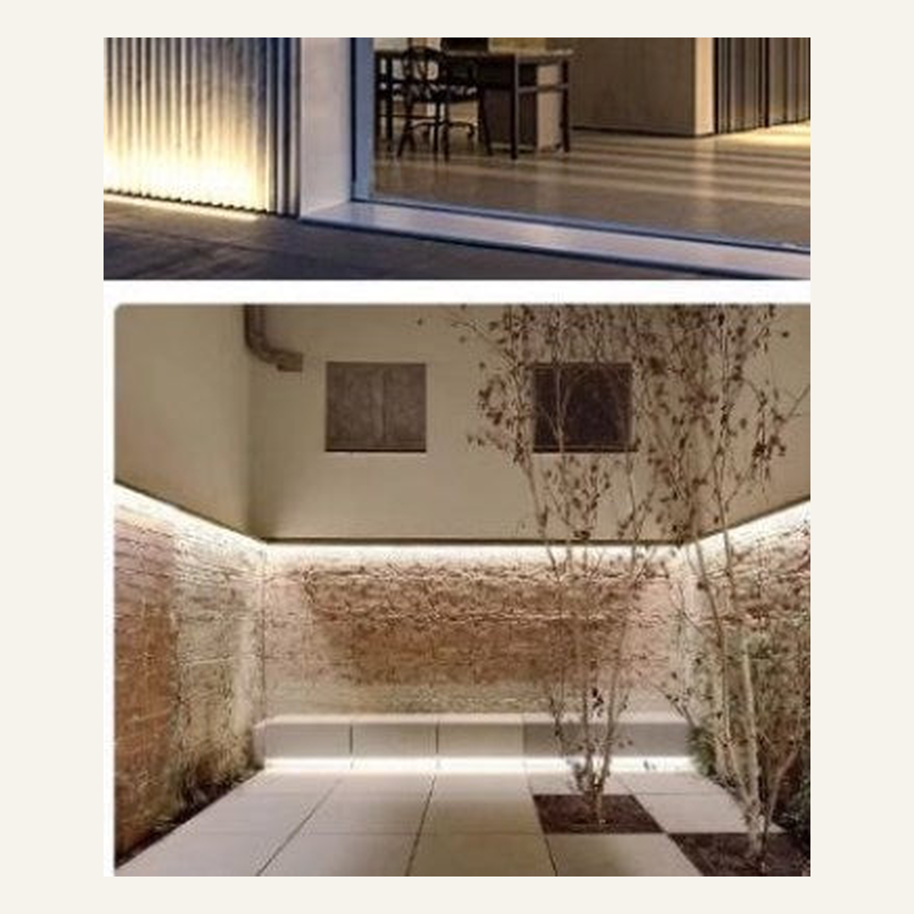 Warm-white LED wall washer illuminating an architectural wall