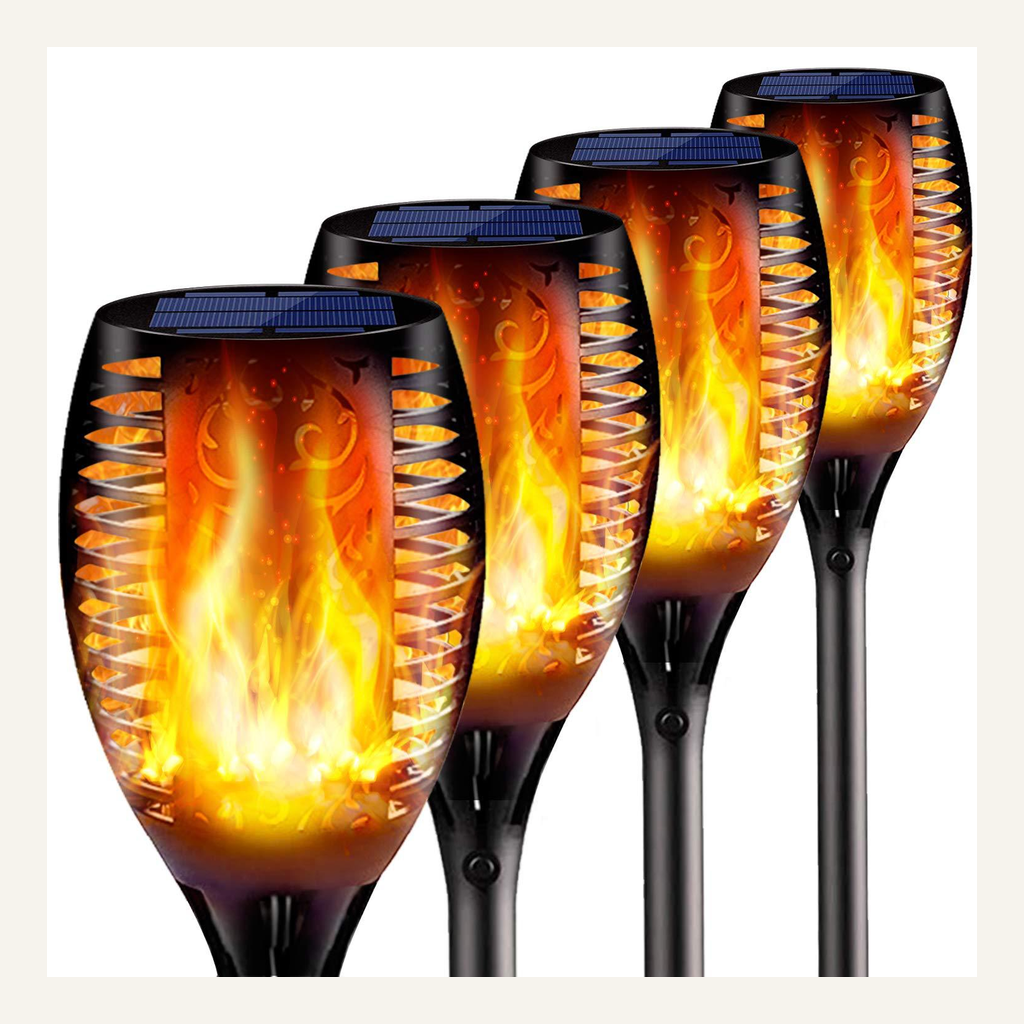 Four solar flame-effect garden lights full product view