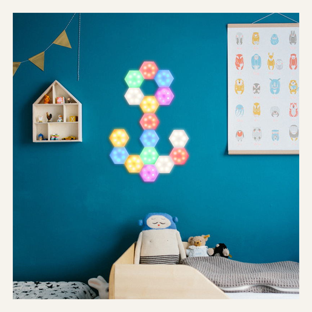 Modular hexagonal LED wall lights in a bedroom