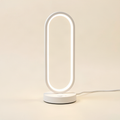White LED bedside lamp on warm off-white background